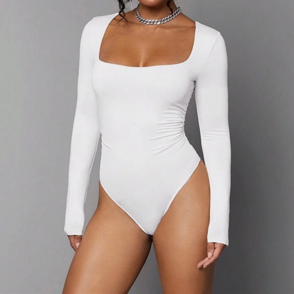 New white color bodysuit long sleeve xs s 0-2 size great quality